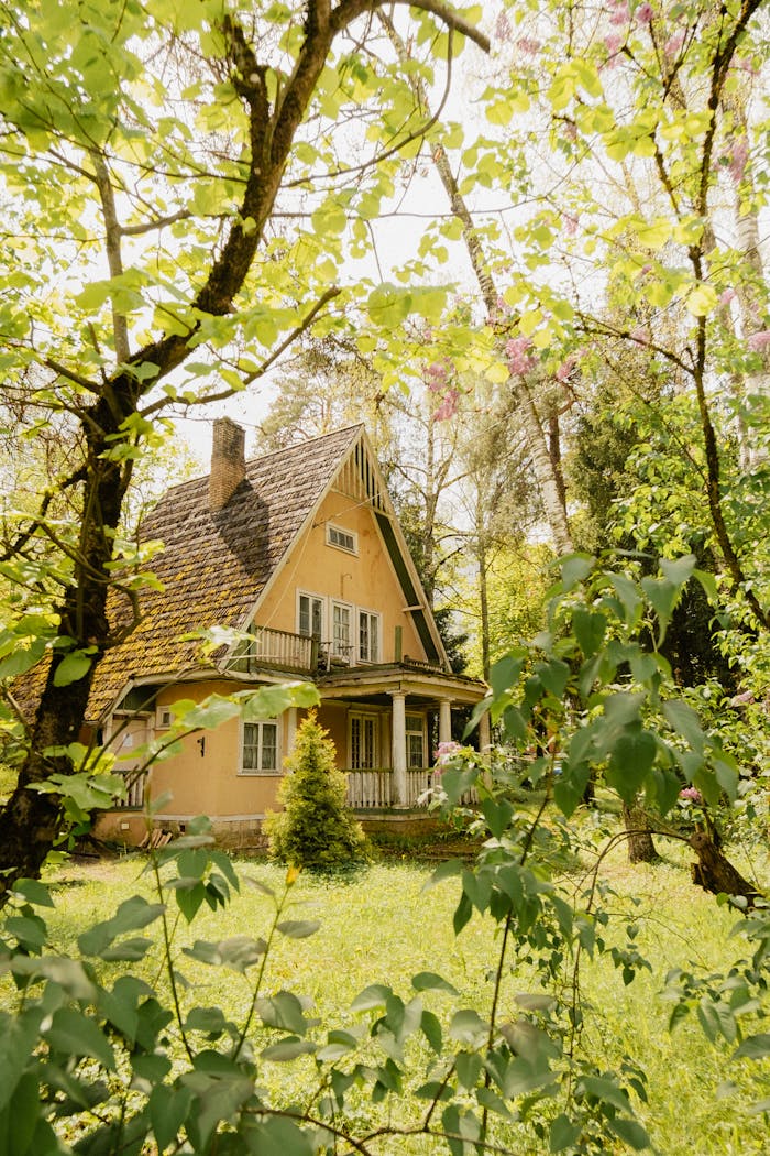 A picturesque cottage amidst vibrant spring greenery, ideal for nature lovers and serene retreats.